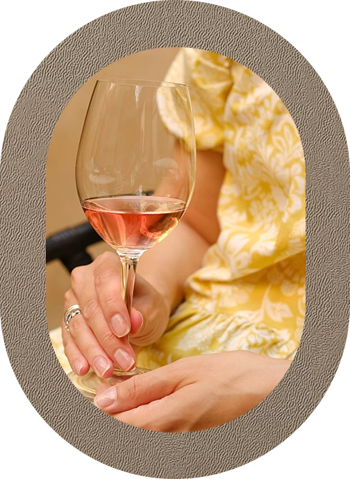 a woman holding a glass of wine