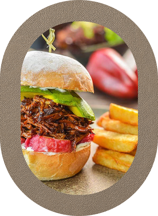 a sandwich with meat and vegetables on a plate