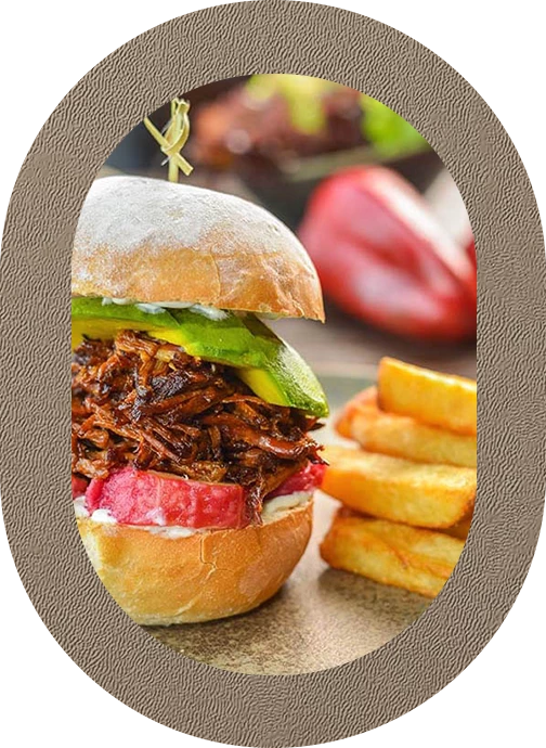 a sandwich with meat and vegetables on a plate