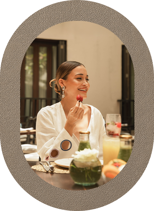 a woman eating a piece of food