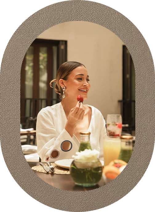 a woman eating a piece of food