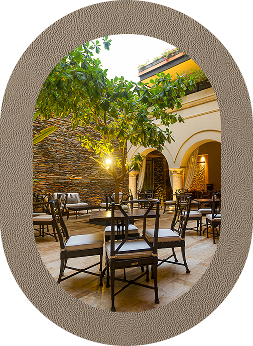 a patio with chairs and tables