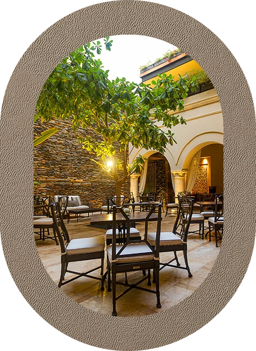 a patio with chairs and tables