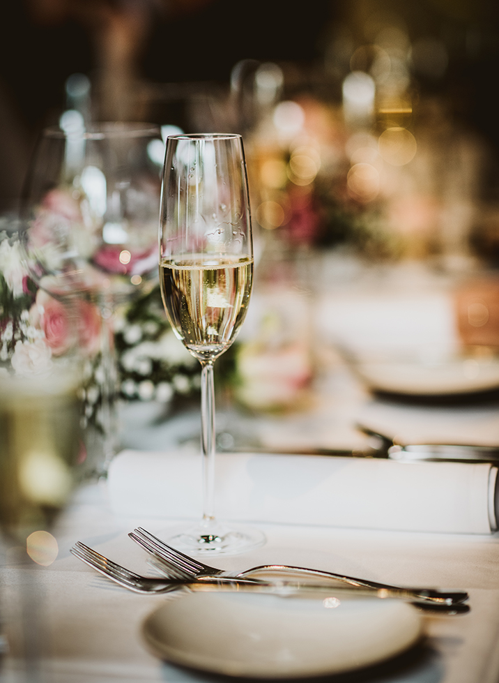 a glass of champagne on a table
