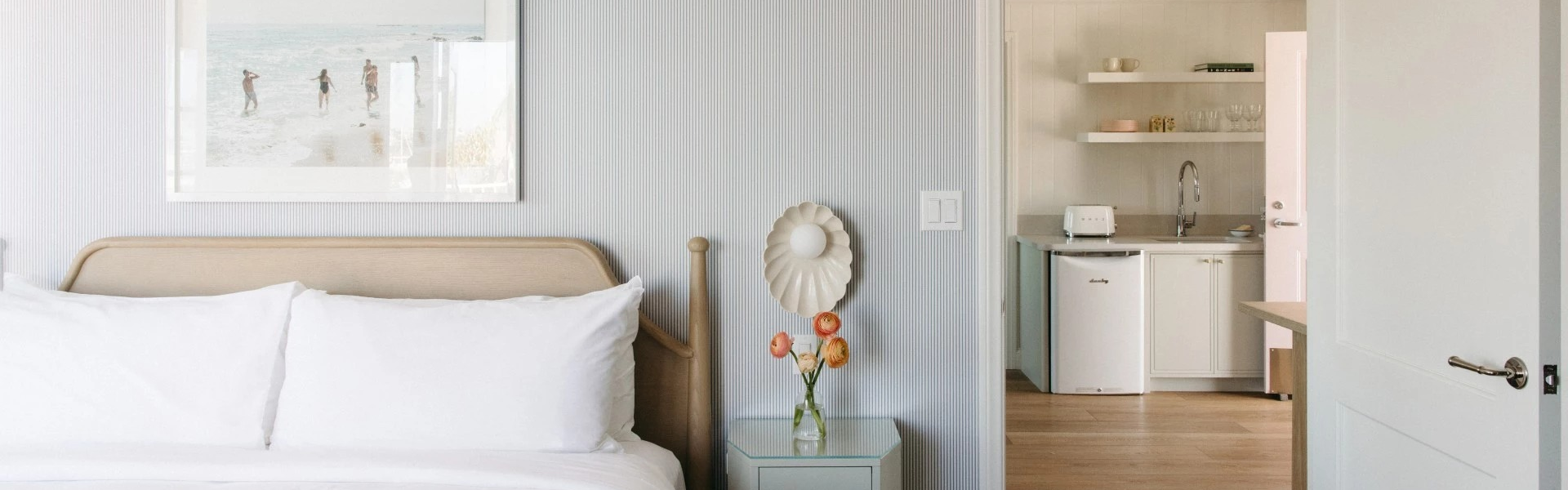 a vase of flowers on a nightstand