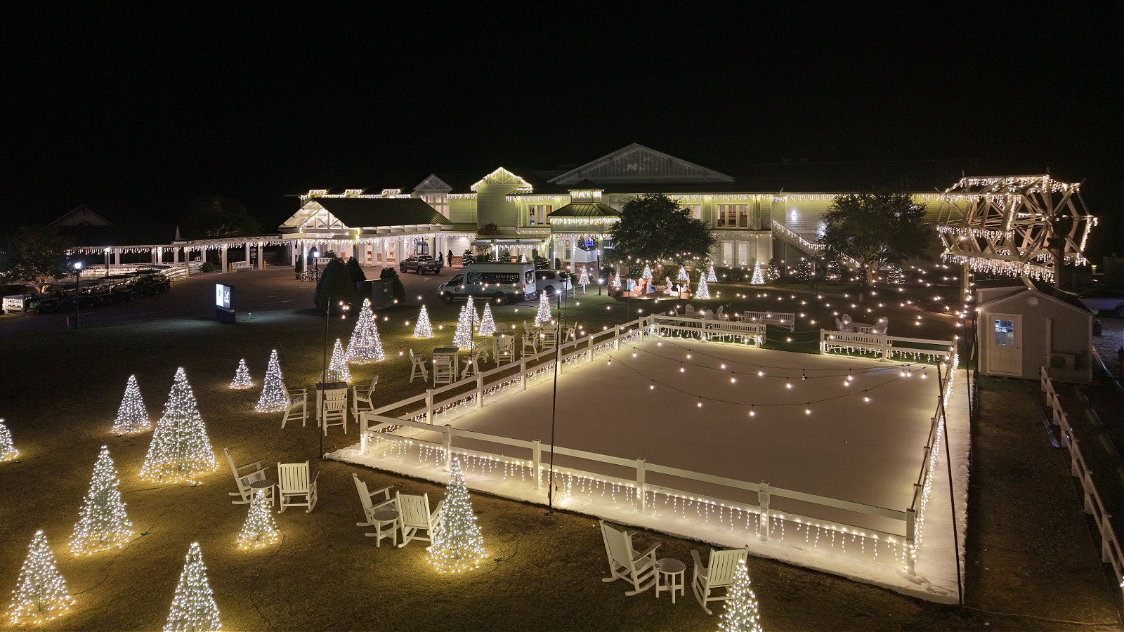 a large building with a pool and christmas lights
