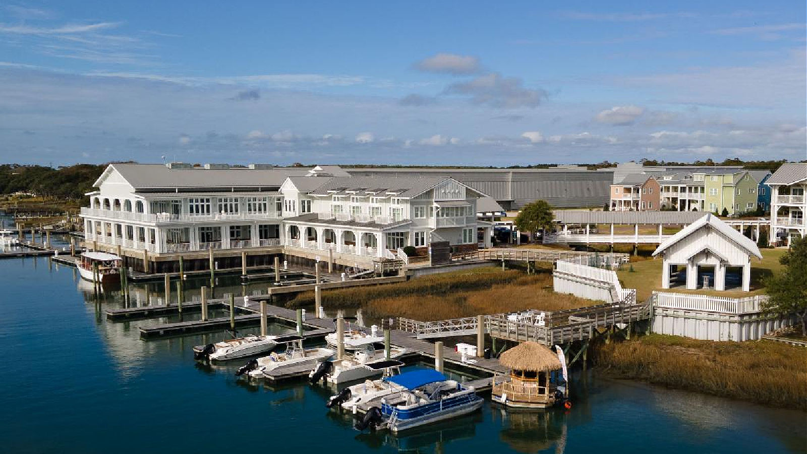 a large building with boats in the water