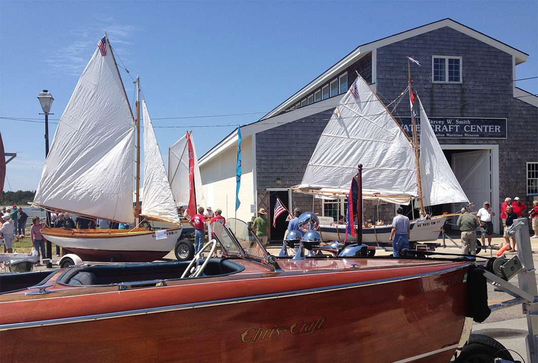 a group of boats parked outside of a building