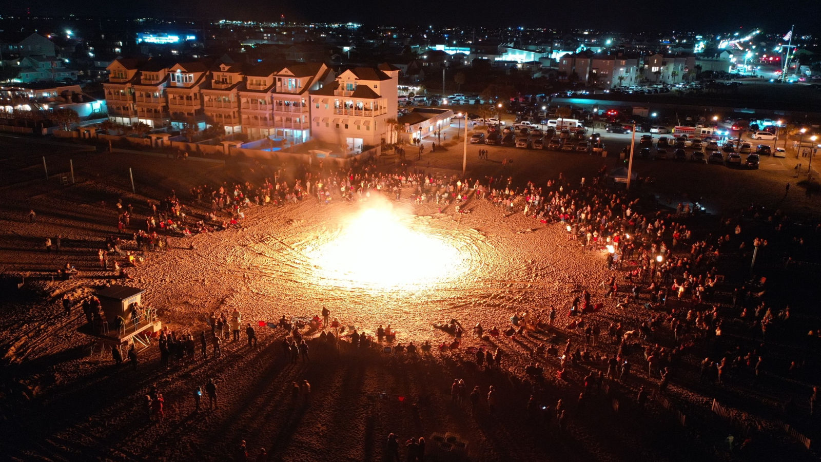a large group of people around a fire