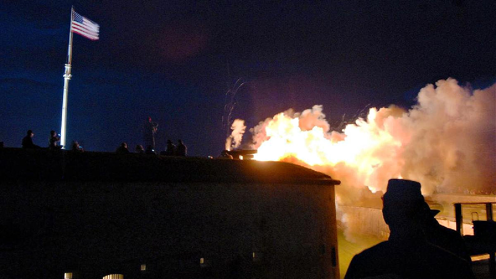 a group of people watching a fire