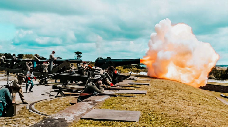 a group of people firing guns