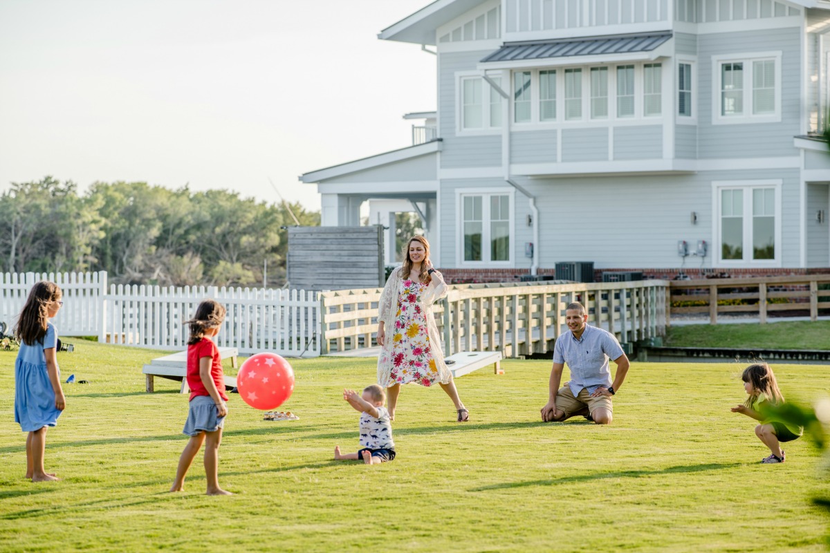 a family playing in the grass