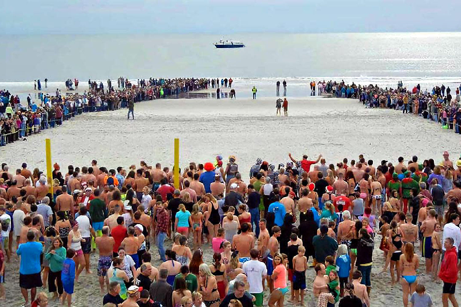 a large group of people on a beach