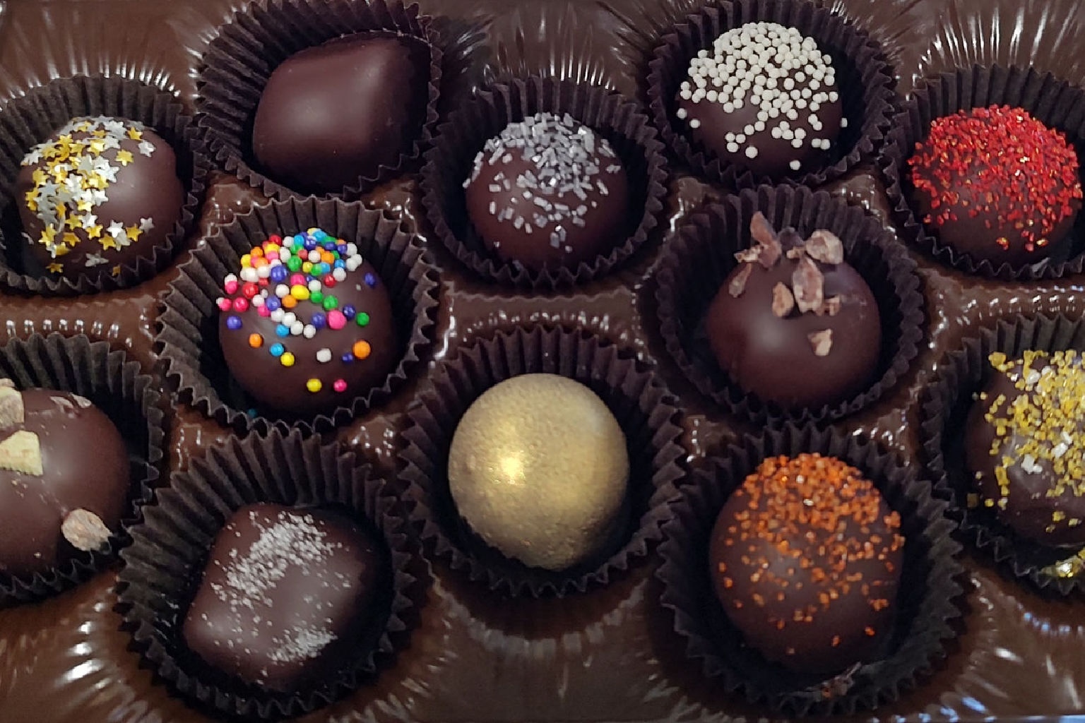 a box of chocolates with sprinkles