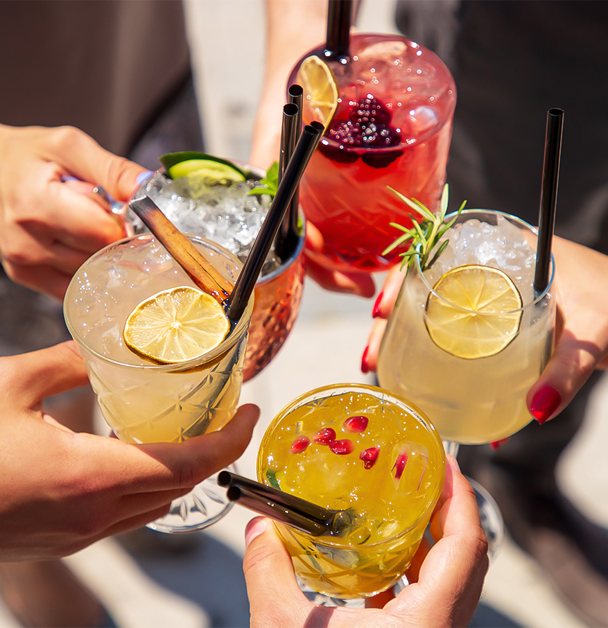 a group of hands holding drinks