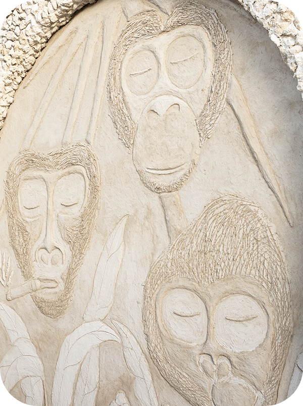 a stone carving of monkeys