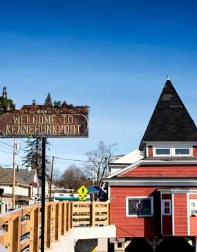 a sign next to a building in Kennebunkport Maine