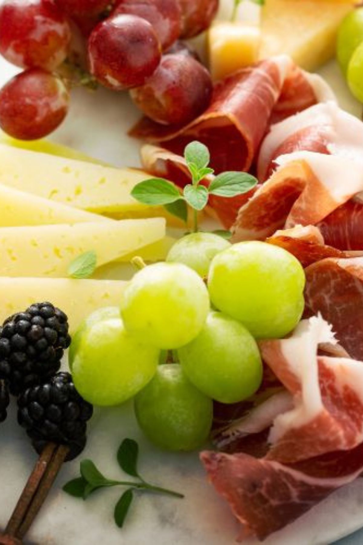 a plate of food with fruit and cheese