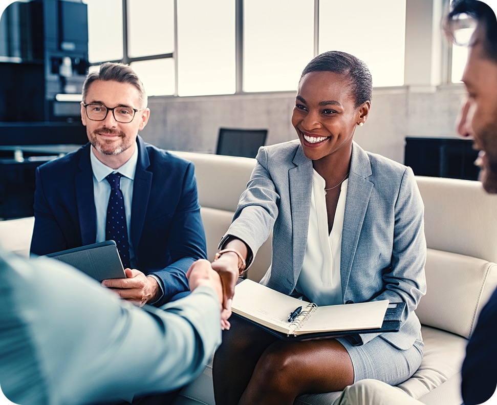 a woman shaking hands with a man