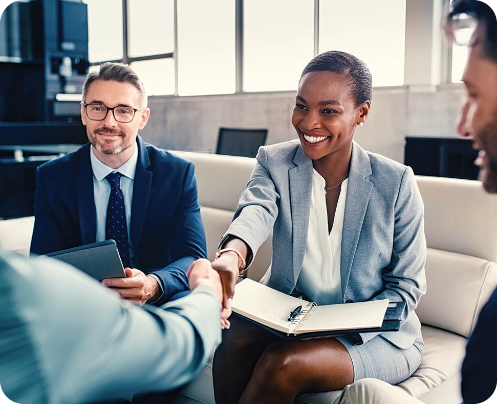 a woman shaking hands with a man