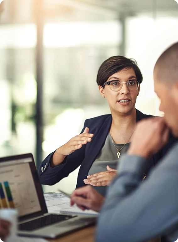 a woman talking to a man