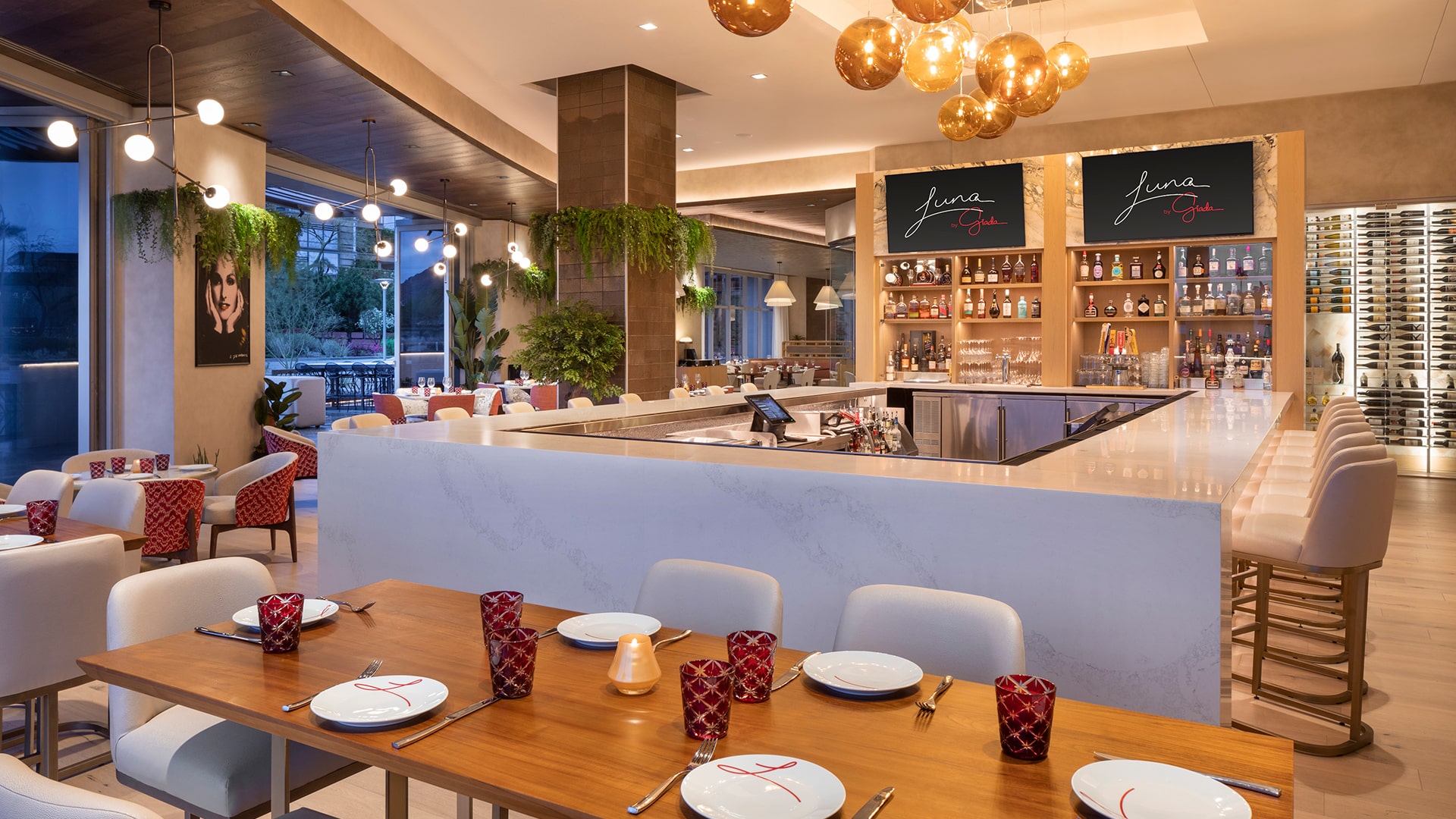 a restaurant with a large counter and tables