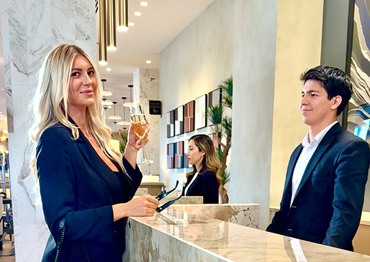a man and woman standing at a counter