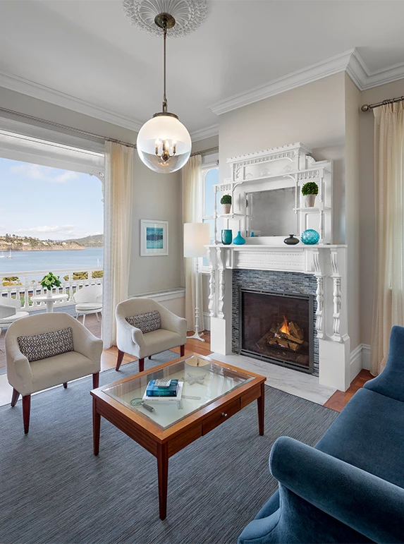 a living room with a fireplace and a couch
