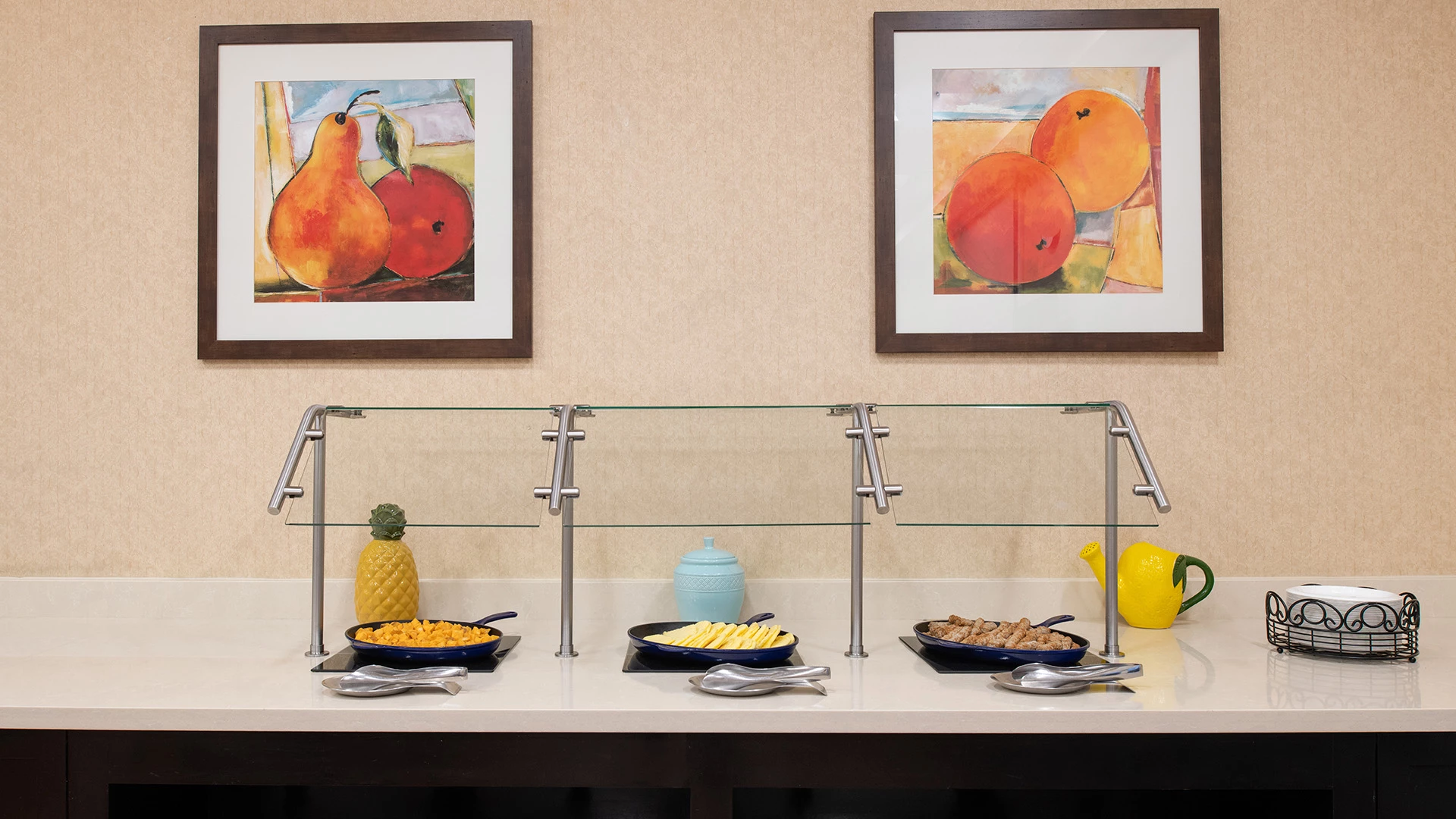 A buffet table with various food items and drinks.