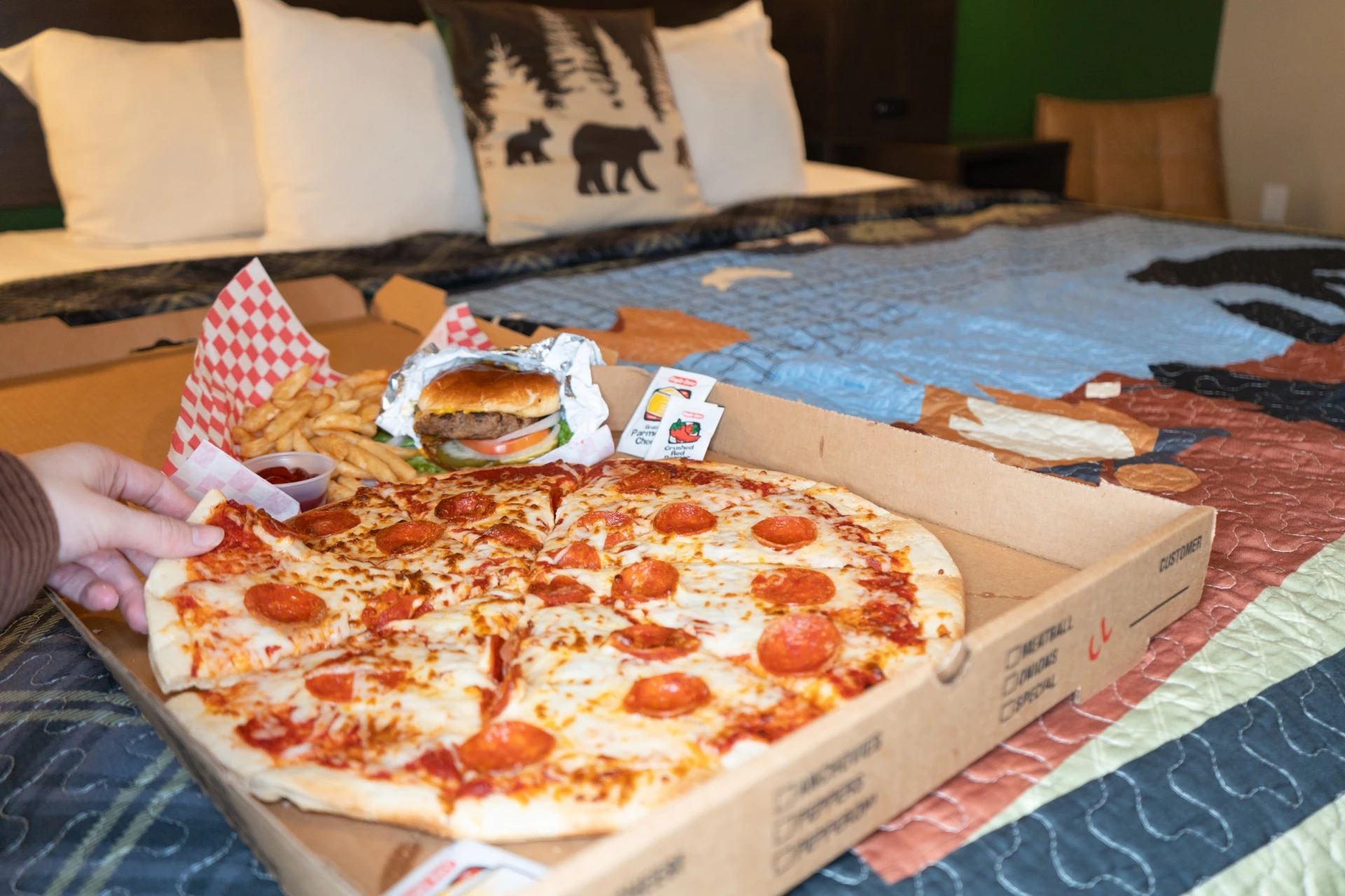 a pizza and fries in a box