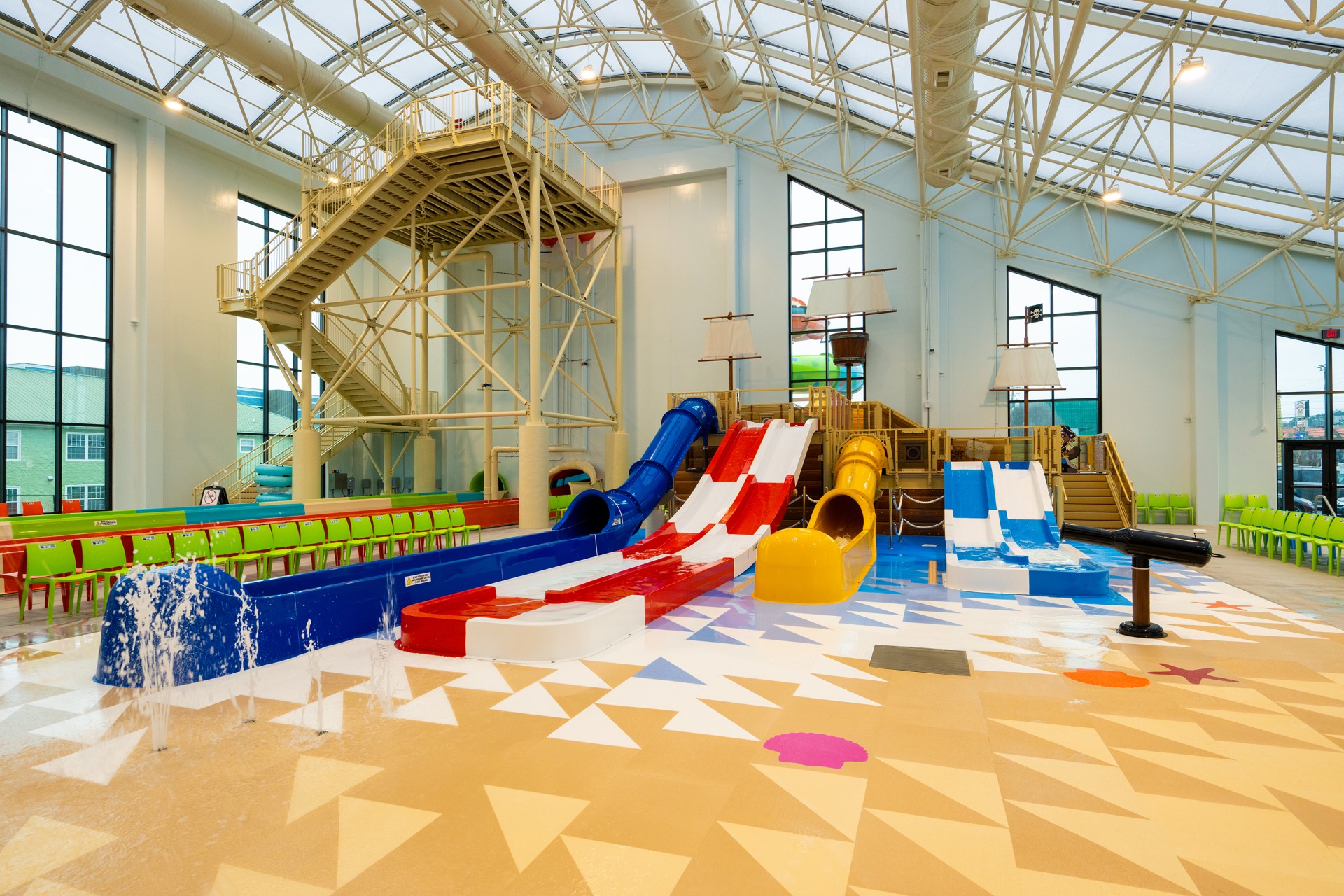 a large indoor water park with a slide