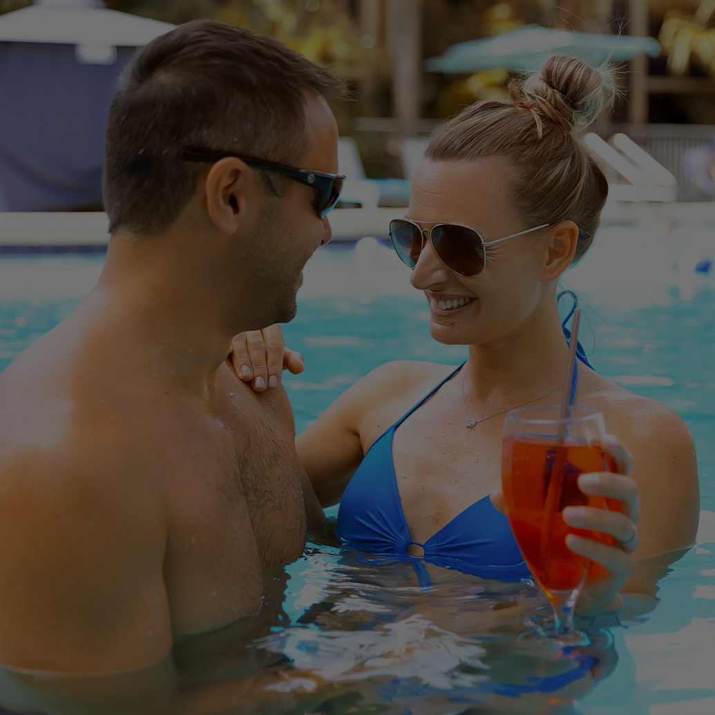 a man and woman in a pool