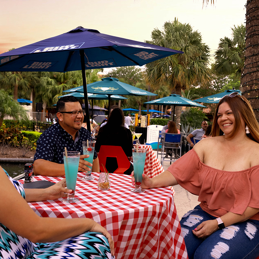 a group of people sitting at a table with drinks