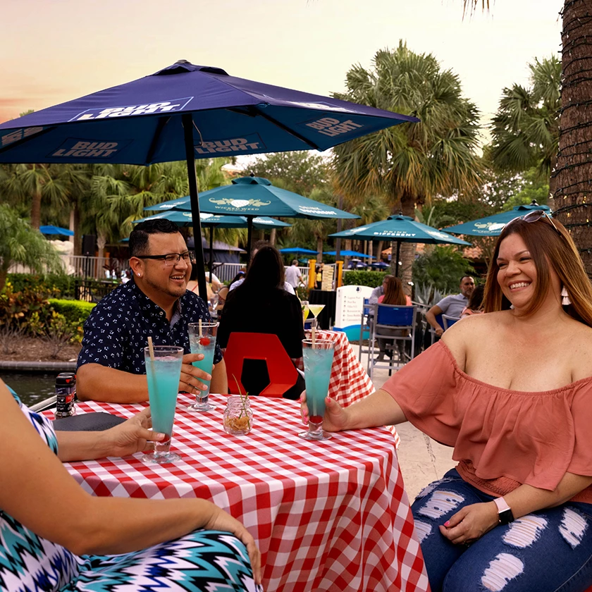 a group of people sitting at a table with drinks
