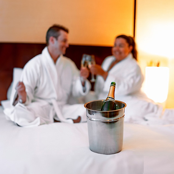 a man and woman in a hotel room