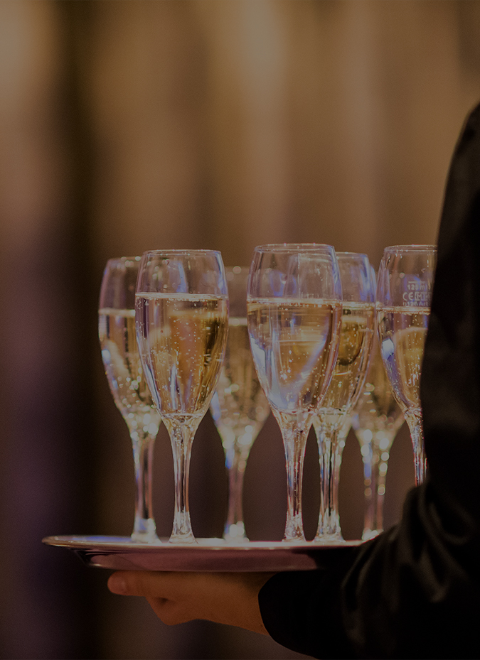 a tray of champagne glasses