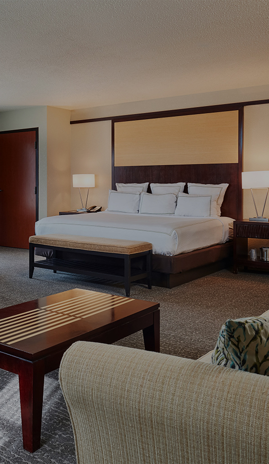 a bedroom with a bed and a table