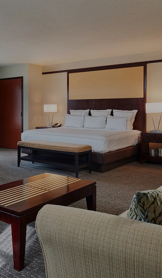 a bedroom with a bed and a table