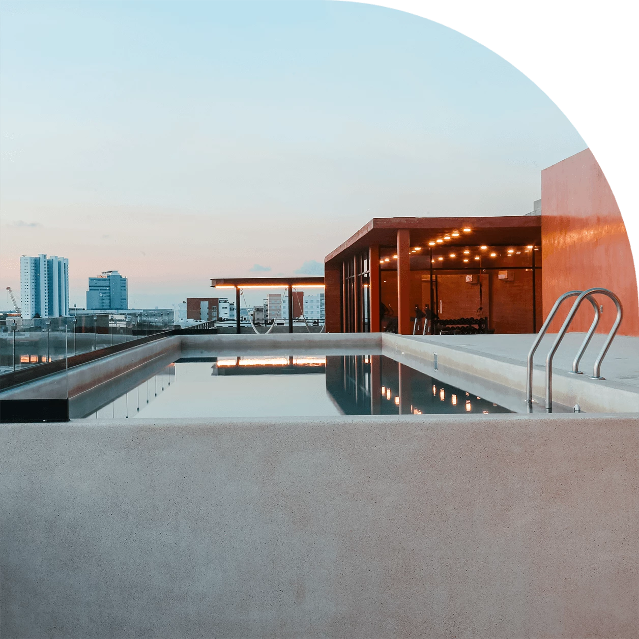 a pool with a building in the background
