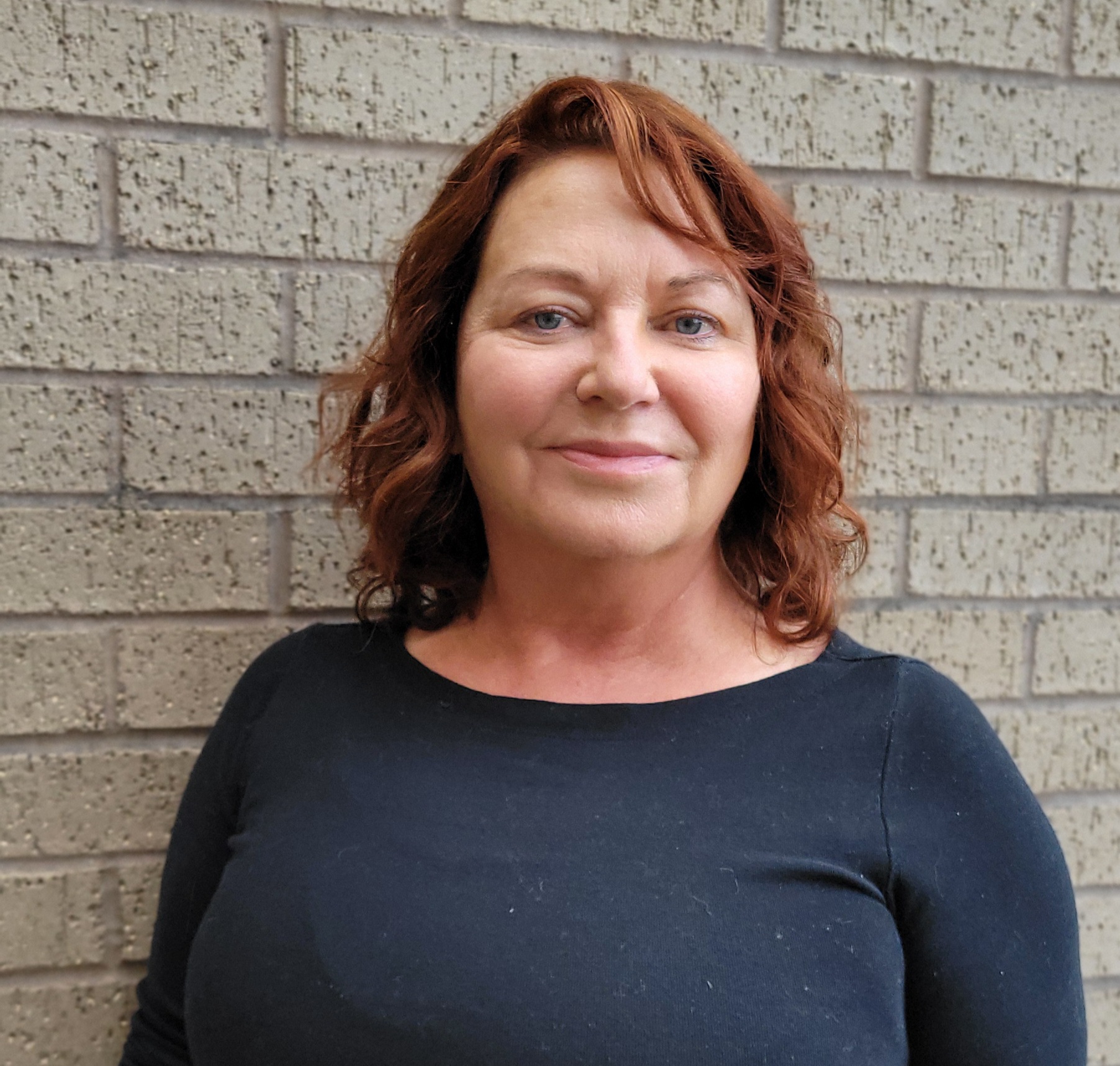 a woman smiling at camera