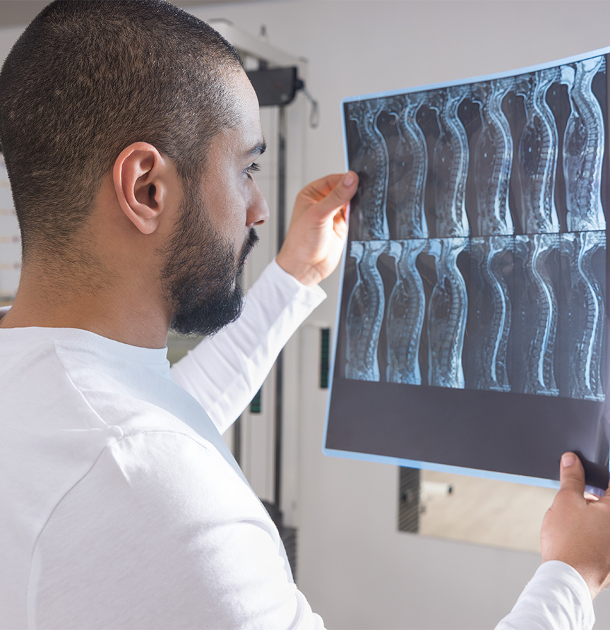 a man looking at an x-ray