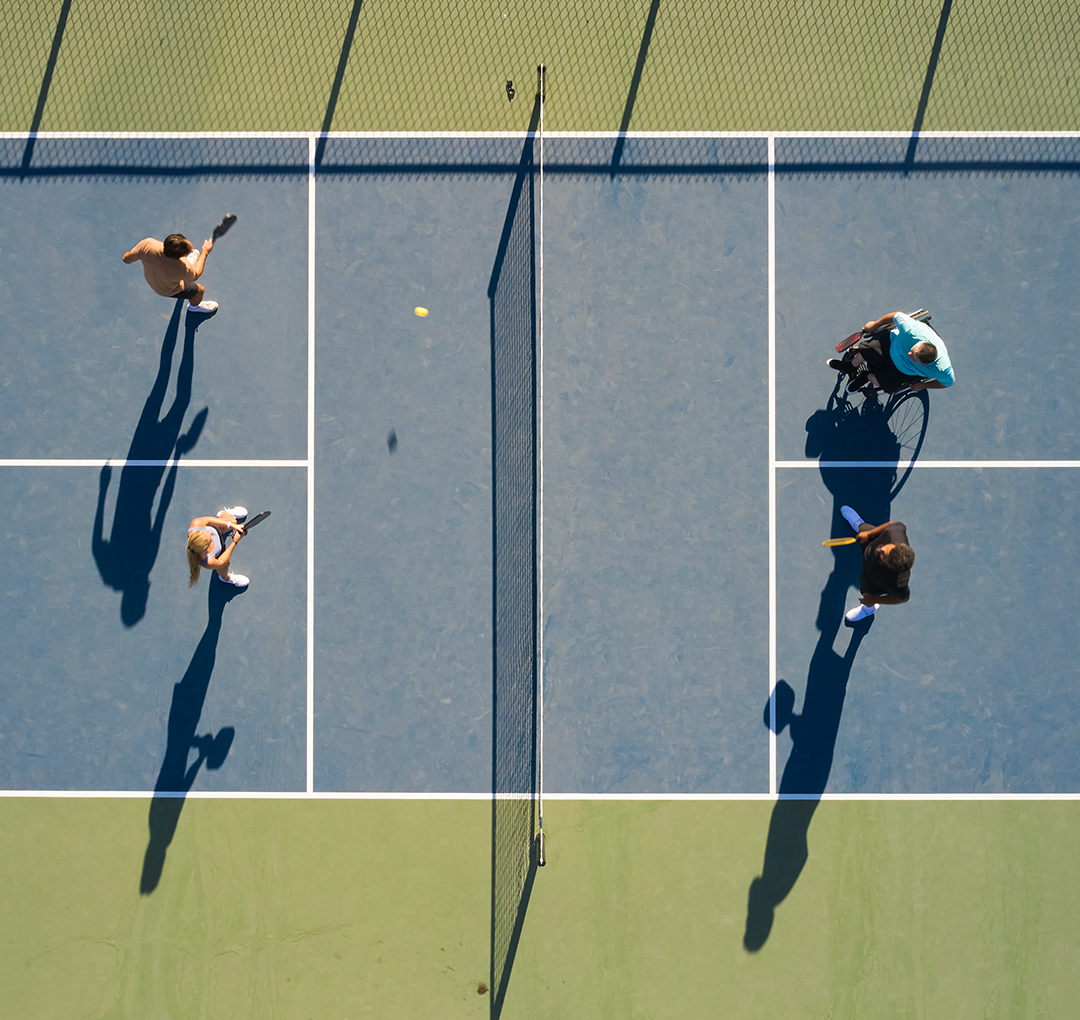 people on a tennis court