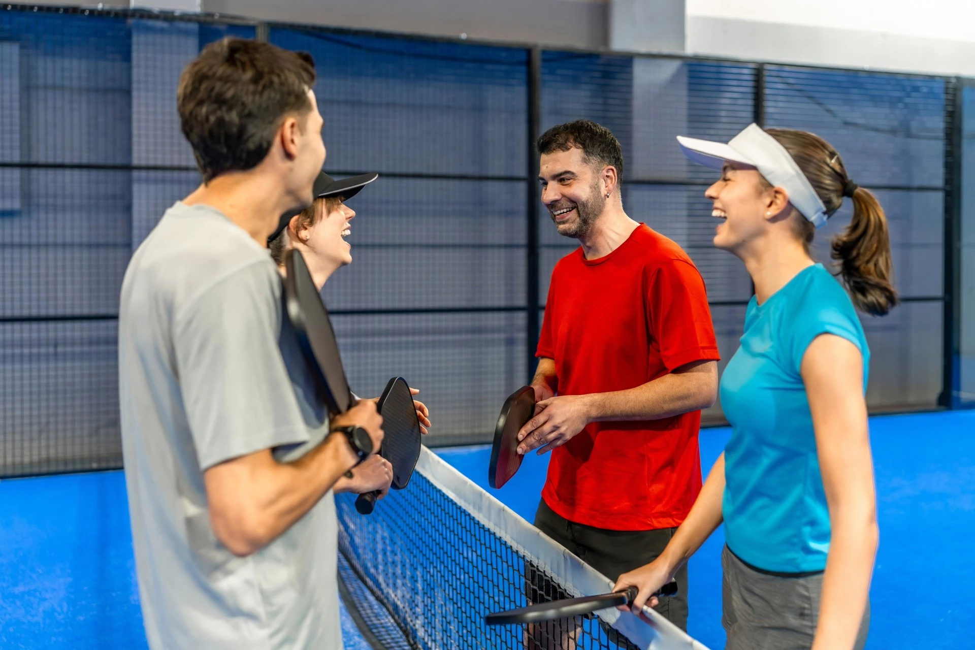 a group of people standing next to a net