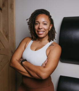 a woman with her arms crossed