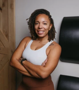 a woman with her arms crossed