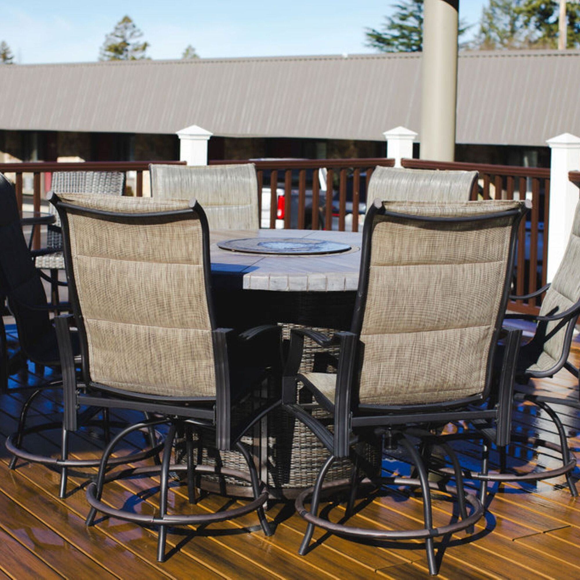 a table and chairs on a deck