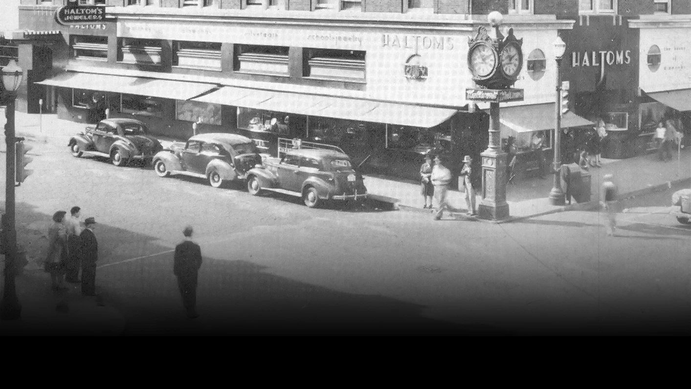 a man walking past a storefront