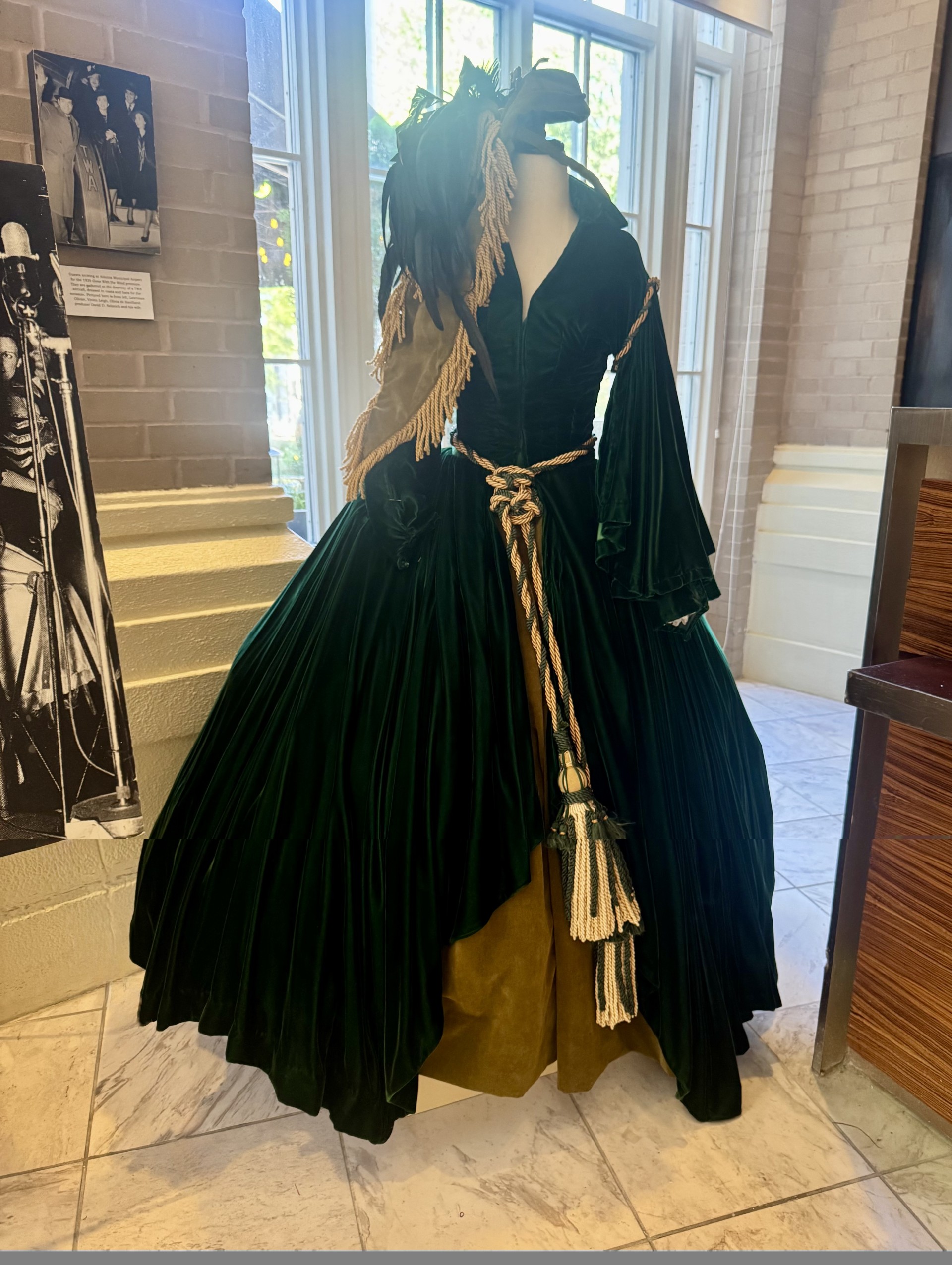 a mannequin wearing a green dress