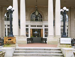 a building with pillars and a table