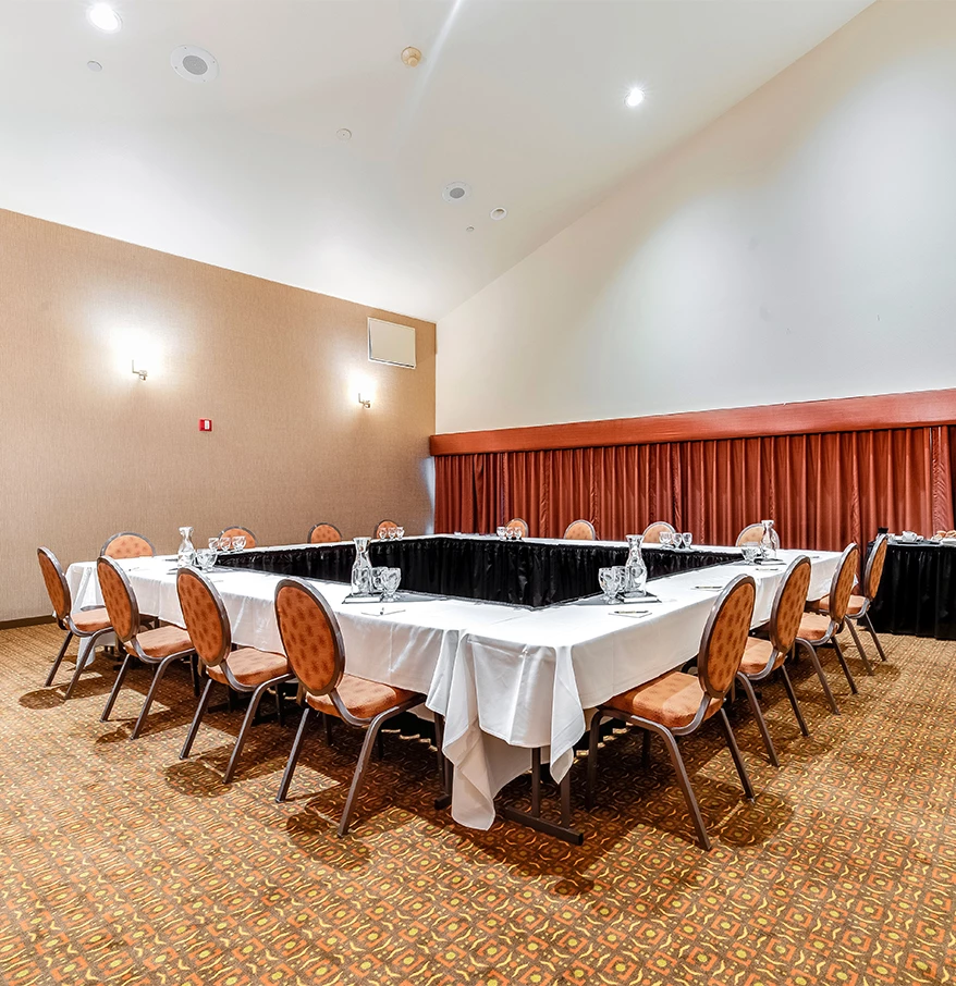 a room with a table and chairs